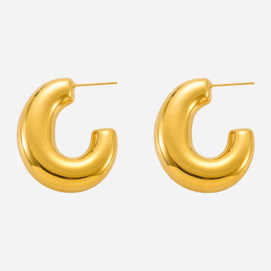 Gold hoop earrings on a white background