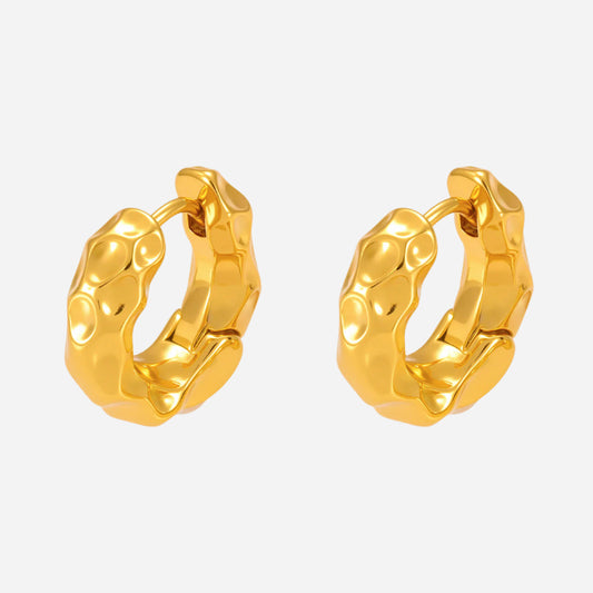 Pair of gold hoop earrings on a white background