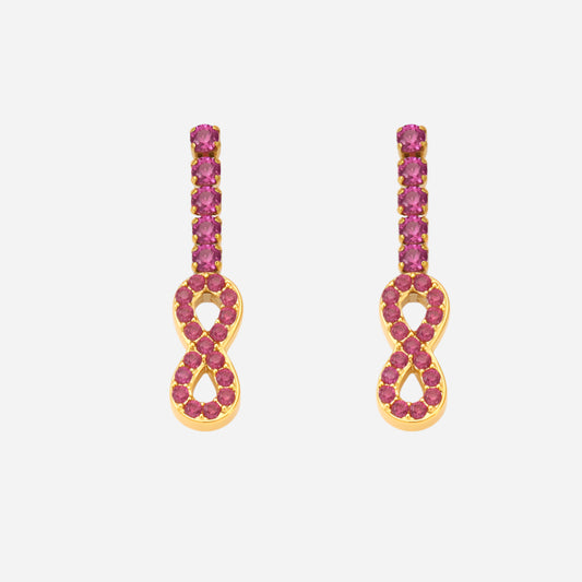 Gold earrings with pink gemstones on a white background
