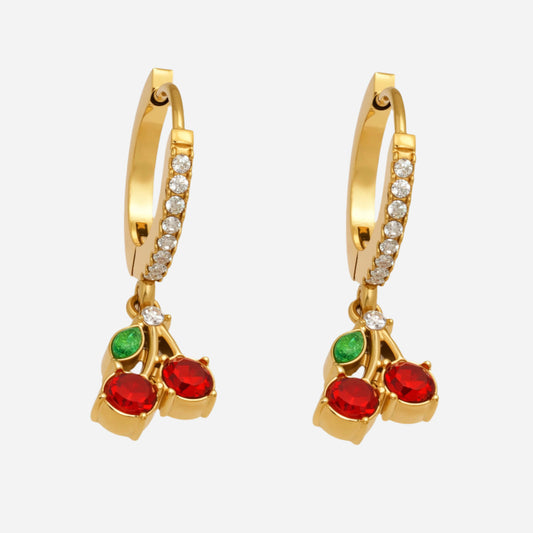 Gold hoop earrings with red and green gemstones on a white background