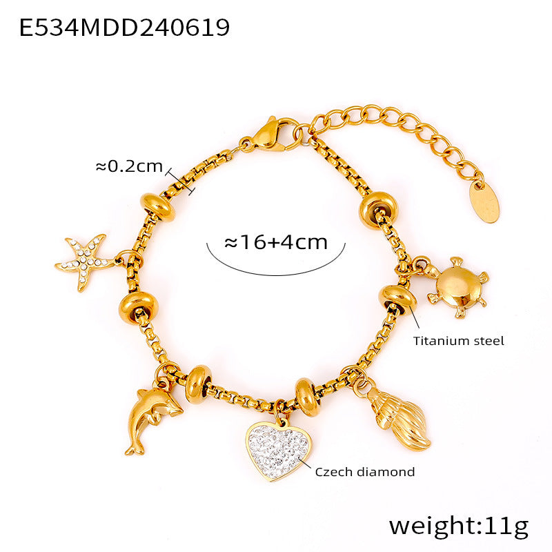 Gold waterproof bracelet with mixed symbolic charms on a clean white background
