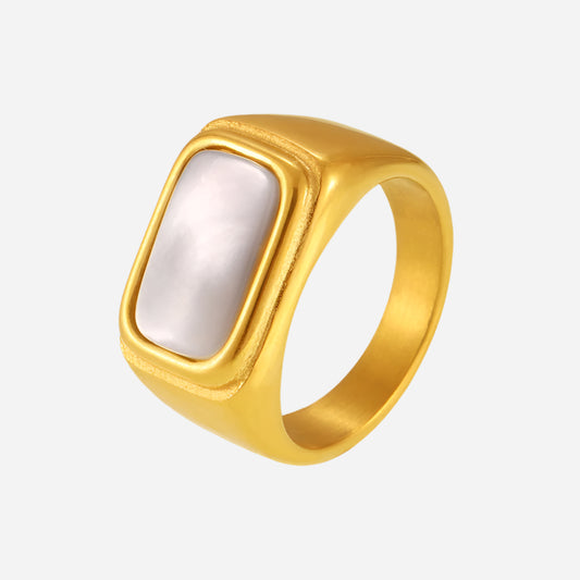 Gold-plated stainless steel pearl ring with white seashell inlay on a light gray background