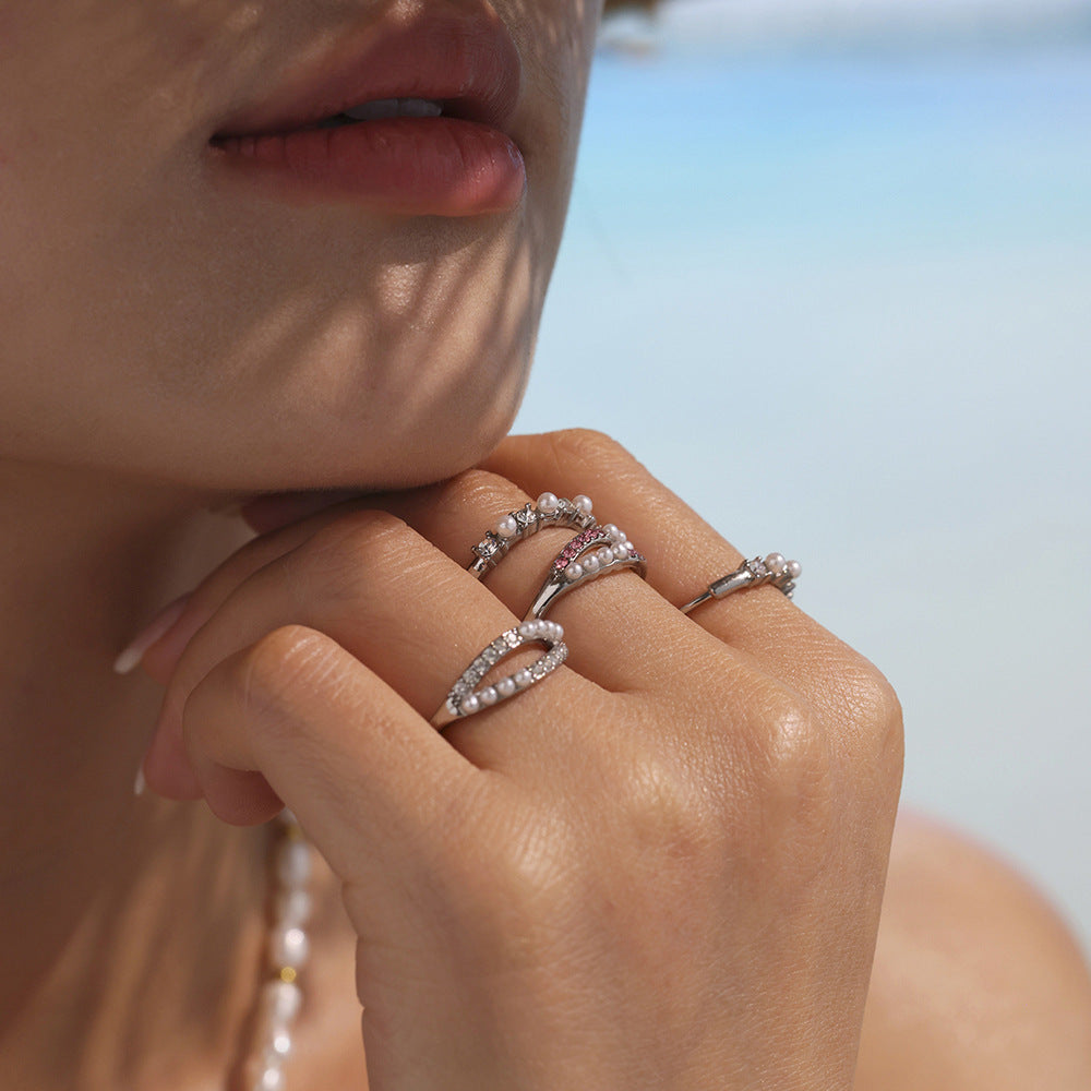 Close-up of stainless steel gold pearl ring featuring zirconia sparkle