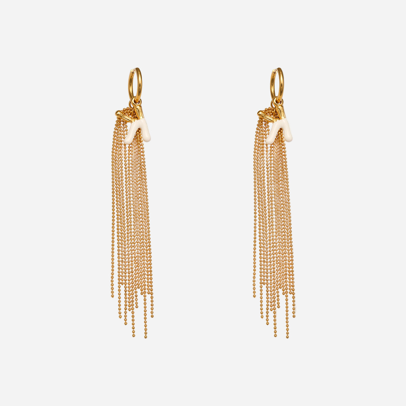 Gold chain tassel earrings on a white background
