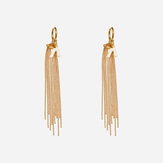 Gold chain tassel earrings on a white background