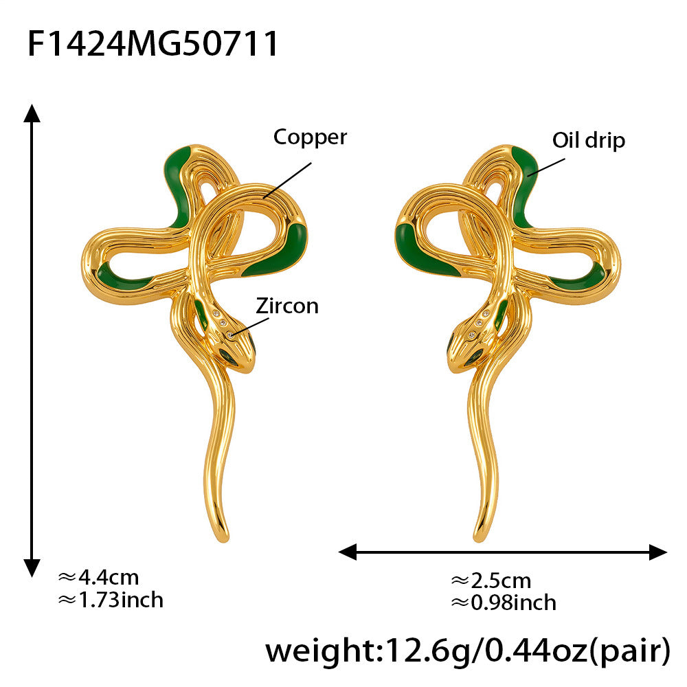 Gold snake-shaped earrings with green accents, labeled for copper, oil drip, and zircon, on a white background.