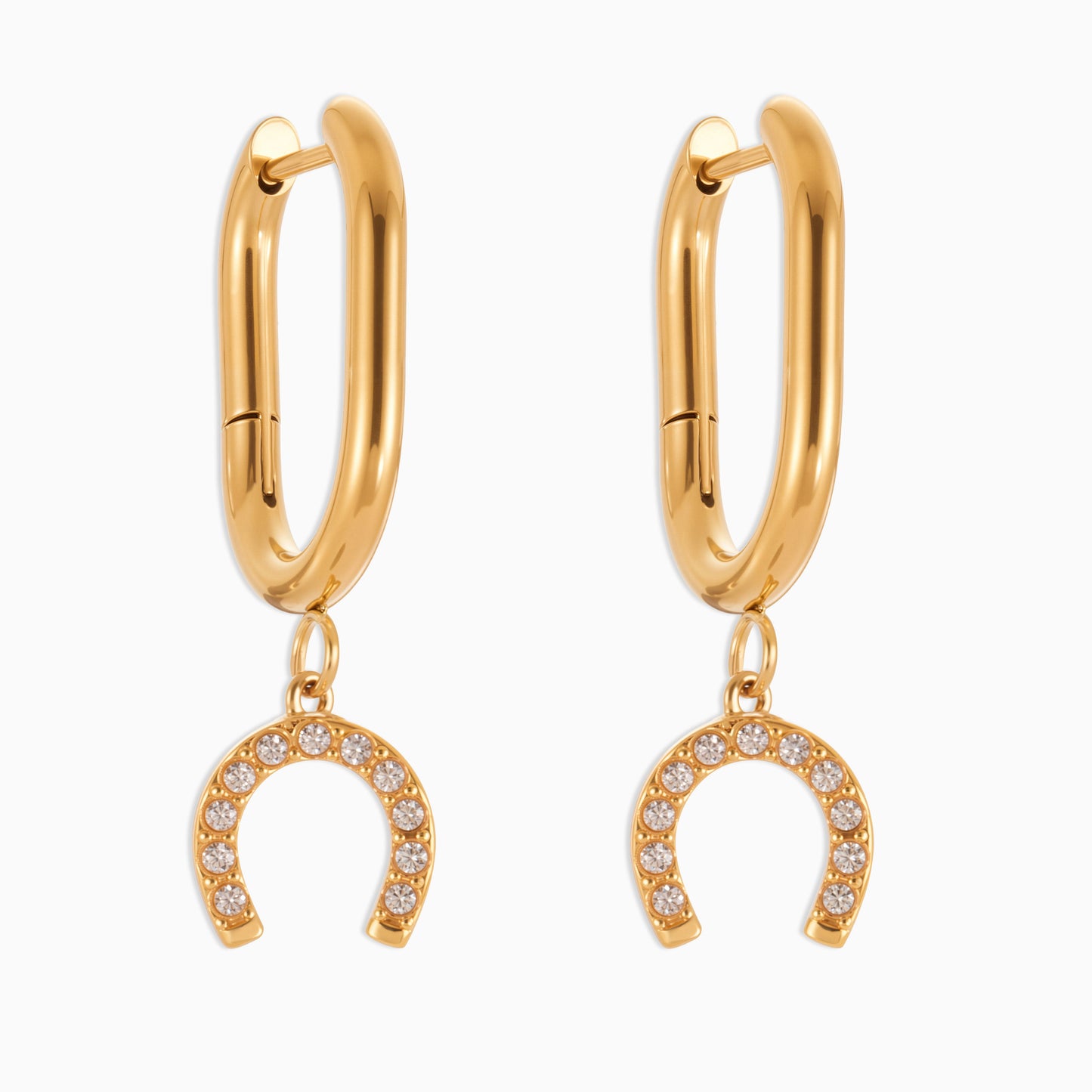 Gold hoop earrings with horseshoe charms on a white background