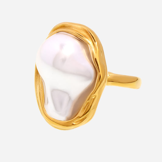 Elegant gold-plated stainless steel ring with large white shell pearl on a light gray background
