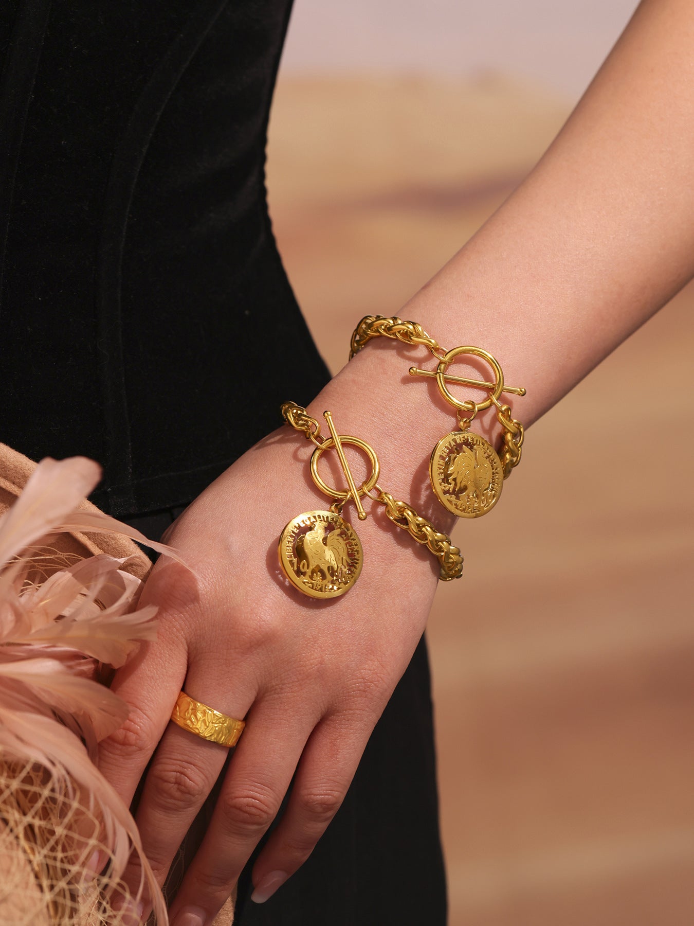 Layered gold and silver curb chain bracelets for street fashion look