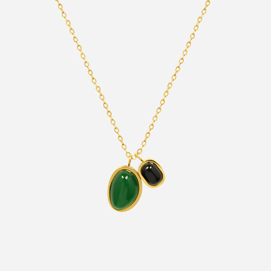Close-up of irregular stone double pendant necklace in gold on white background – boho layered stainless steel charm jewelry