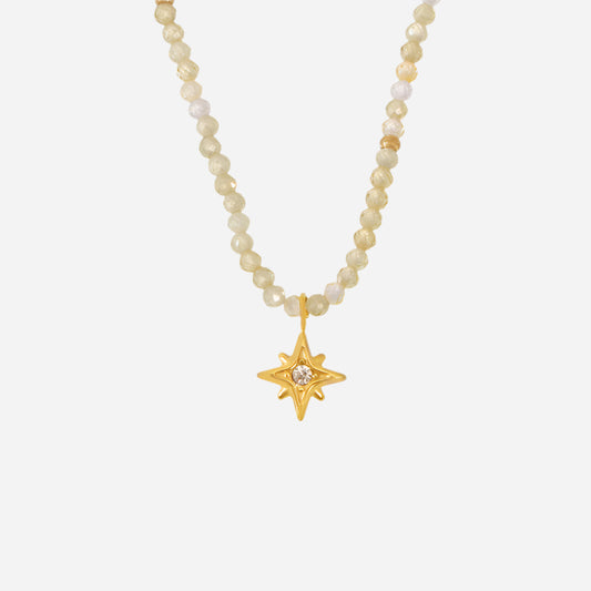 Gold octagonal star charm necklace with zircon and natural stone on white background