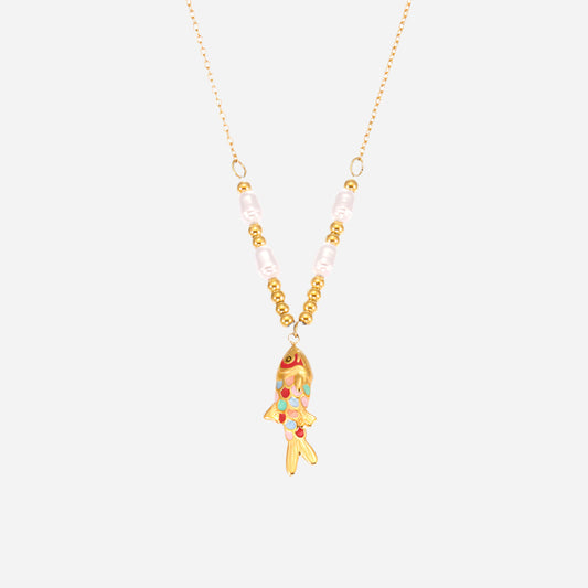 Necklace with a goldfish pendant and pearl beads on a white background