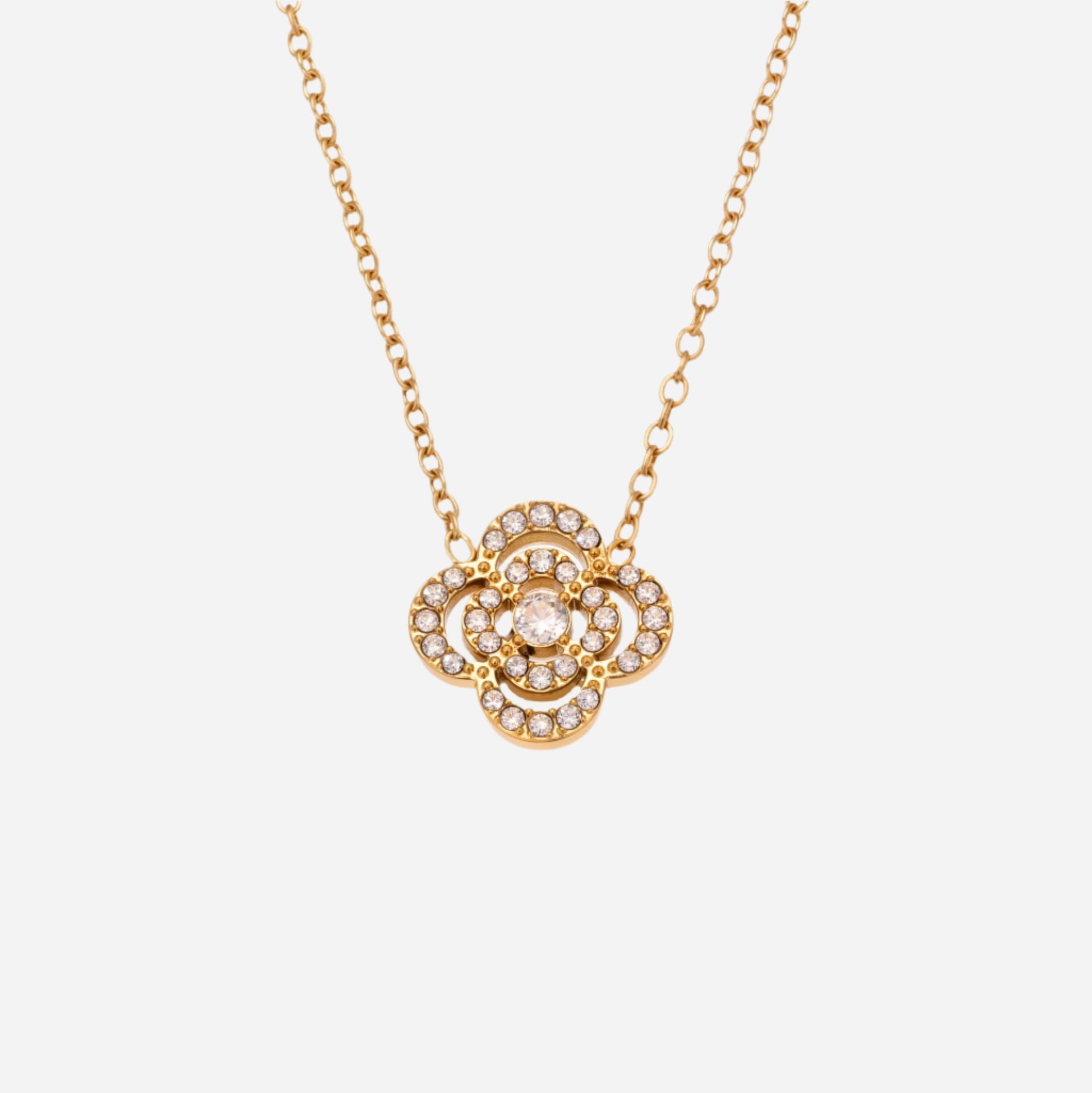 Gold necklace with a floral pendant on a white background