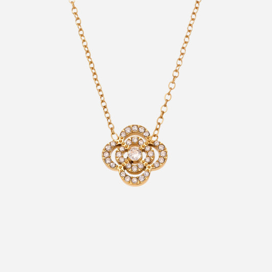 Gold necklace with a floral pendant on a white background