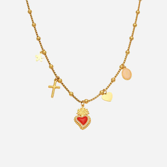 Gold necklace with heart, cross, and round pendants on a white background