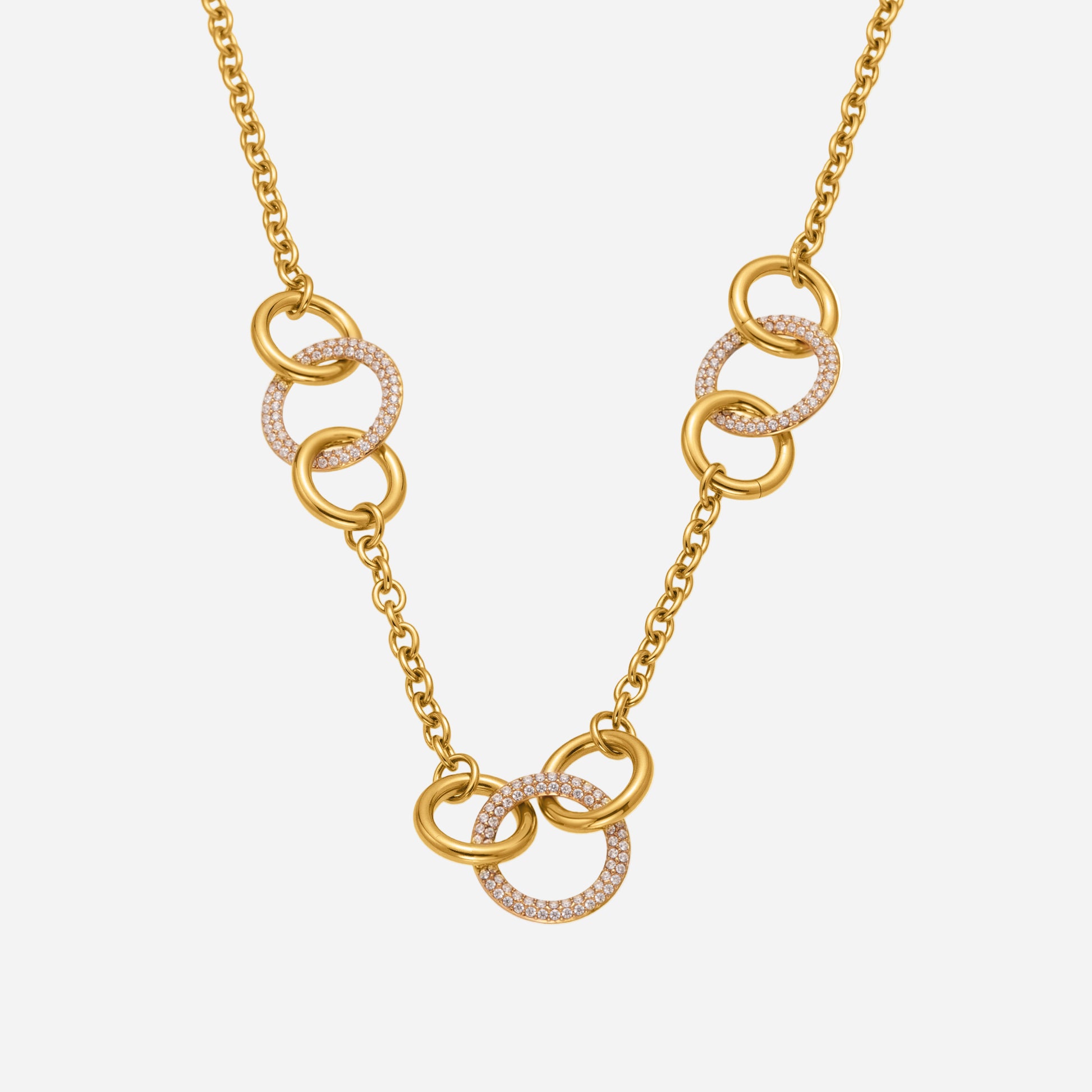 Elegant 18K gold diamond circle necklace with interlocking eternity rings on white background