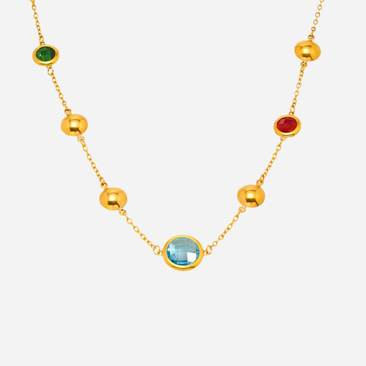 Gold necklace with colorful gemstones on a white background