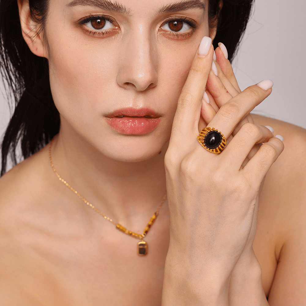 Model hand wearing onyx openwork adjustable gold ring – statement stainless steel jewelry for women