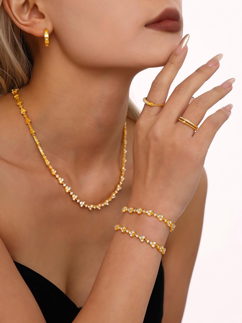 Model wearing Prism Verse multicolor tennis bracelet stacked with other bangles