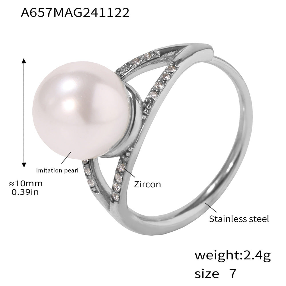 Silver ring with a pearl and zirconia stones, showing details and specifications.