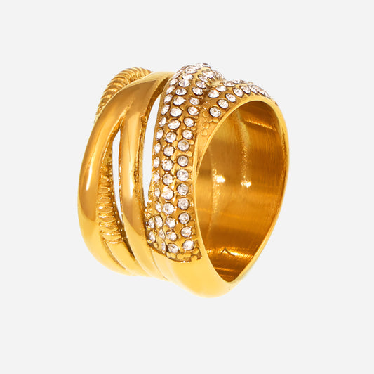 Gold ring with diamond-studded design on a white background