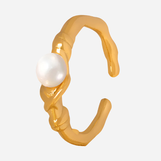 Gold hoop earring with a pearl on a white background