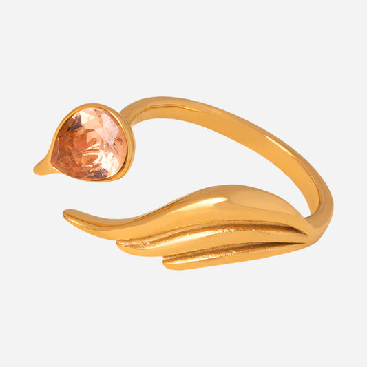 Gold ring with a pink gemstone on a white background