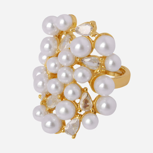 Gold ring with pearls and clear stones on a white background