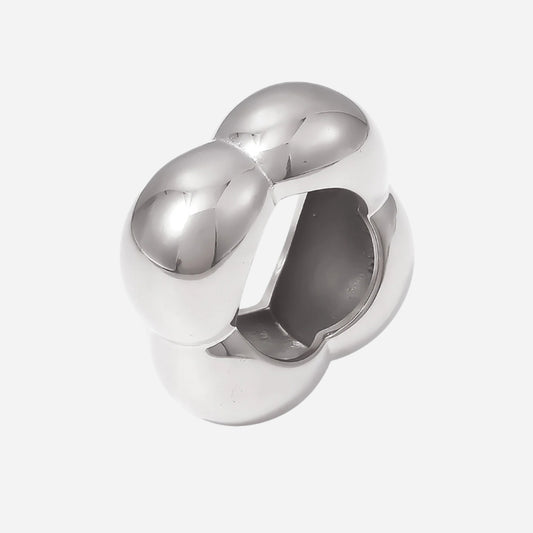 Silver ring with a unique design on a white background