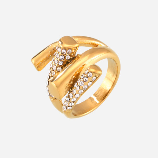 Gold ring with crystal embellishments on a white background