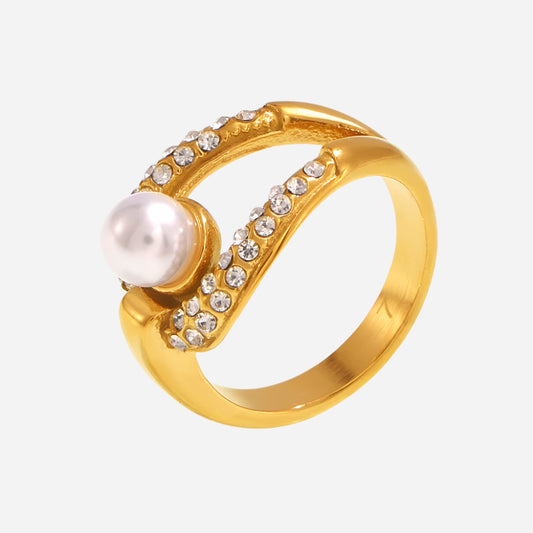 Gold ring with a pearl and small diamonds on a white background