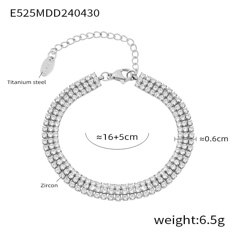  Silver stainless steel bracelet with sparkling zirconia stones on white background – waterproof design