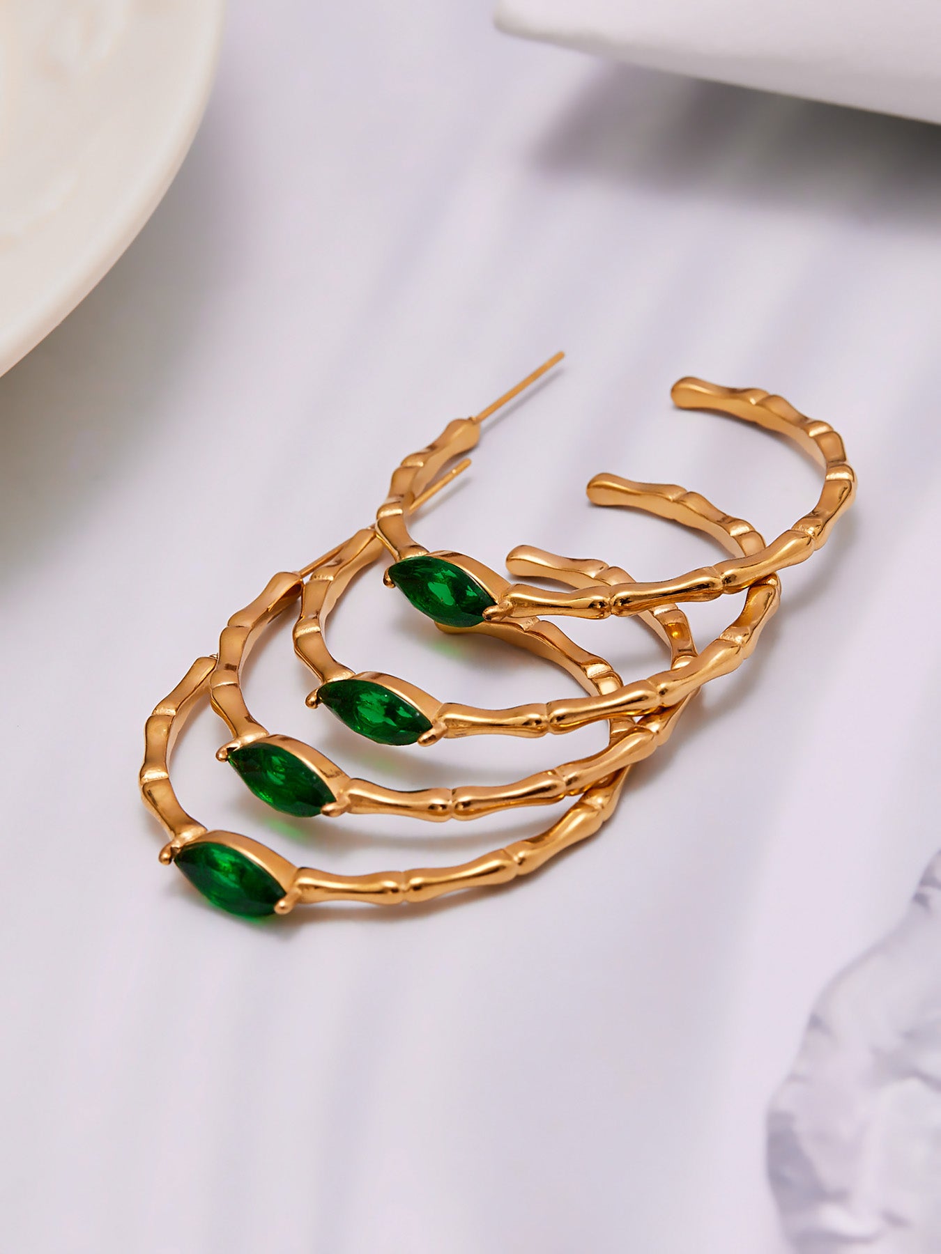 Stacked gold bamboo hoop earrings with green glass stones, stainless steel waterproof jewelry
