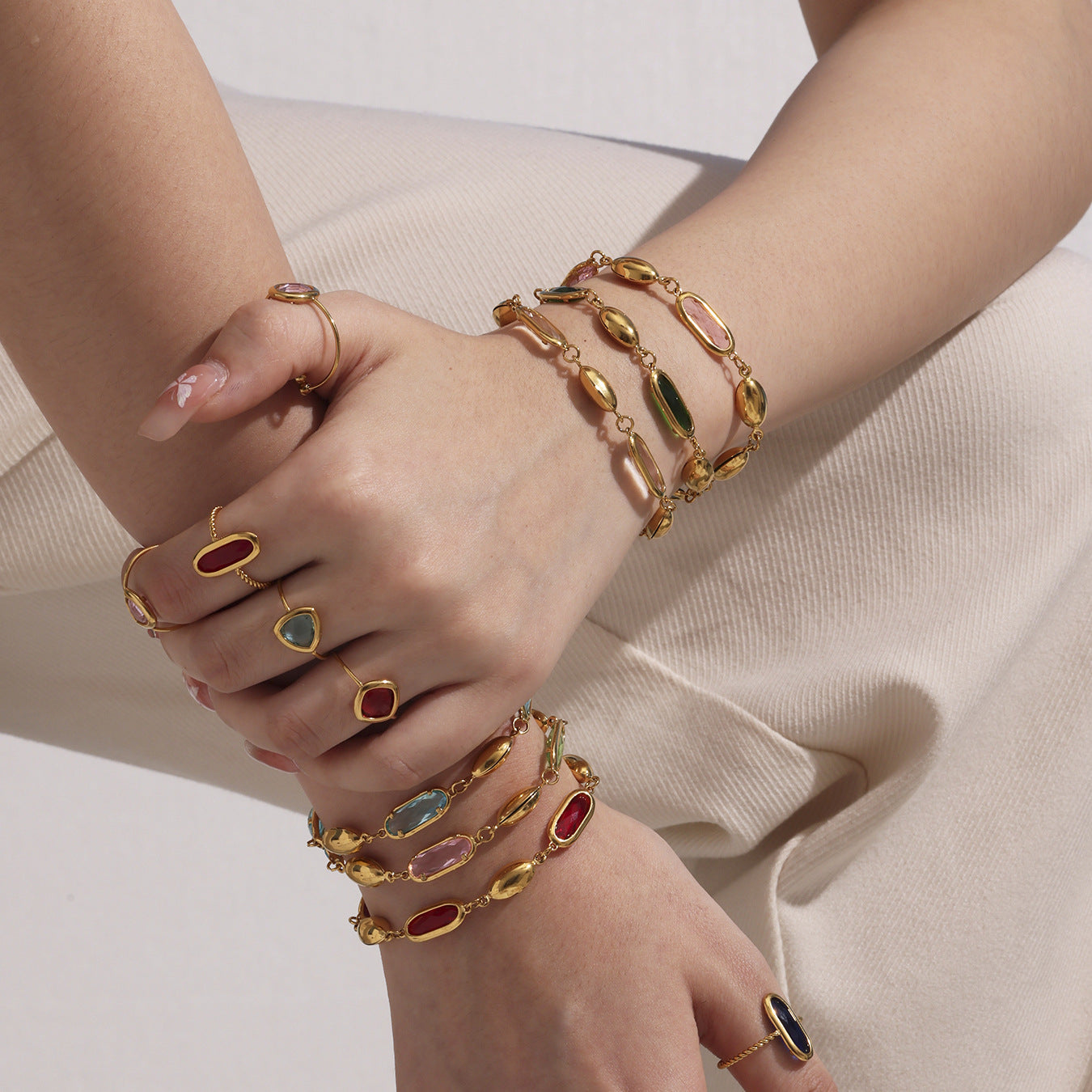 Model Wearing Czech Glass Bracelets with White Pants – Summer Jewelry Styling