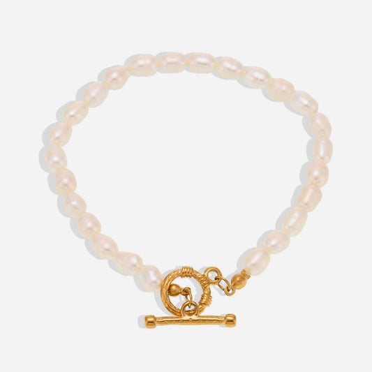 White background view of T-bar pearl bracelet with natural freshwater pearls and gold stainless steel clasp