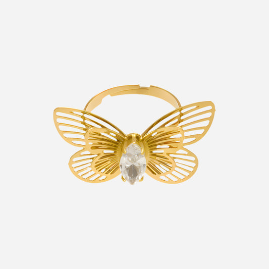 Gold butterfly-shaped ring with a central gemstone on a white background