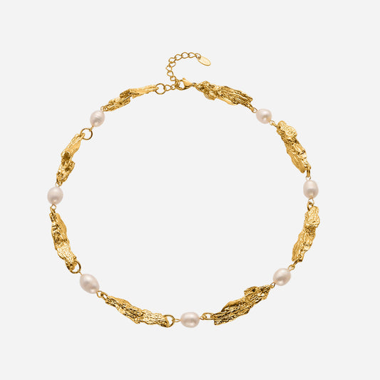 Gold bracelet with pearls on a white background