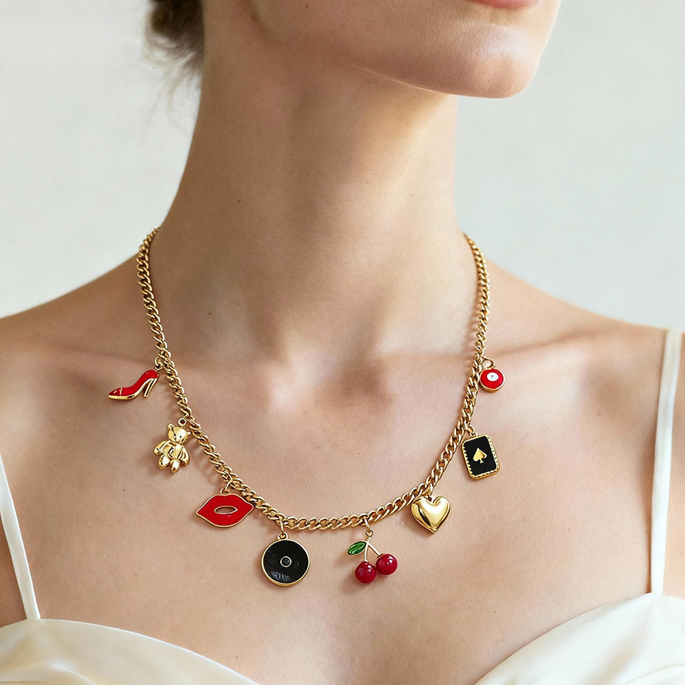 Side view of woman wearing vintage charm necklace with playful enamel symbols, elegant feminine style