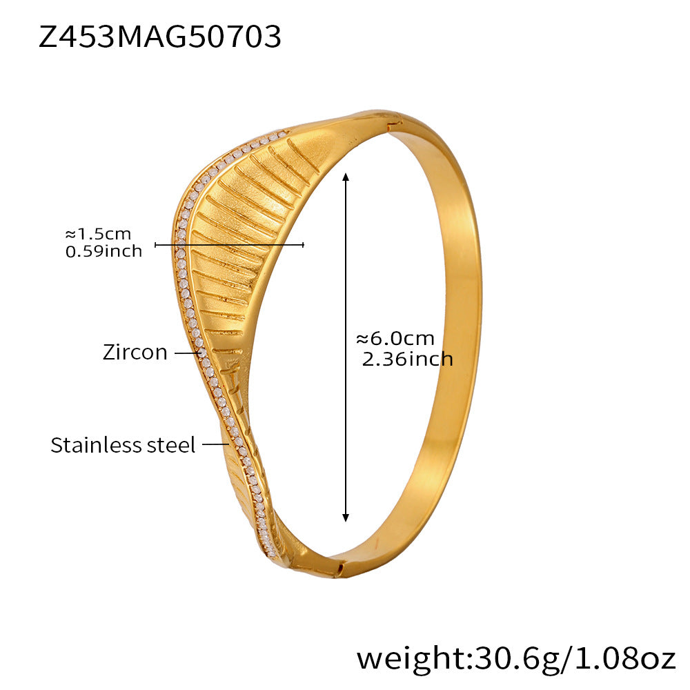 Gold bracelet with measurements and material details on a white background
