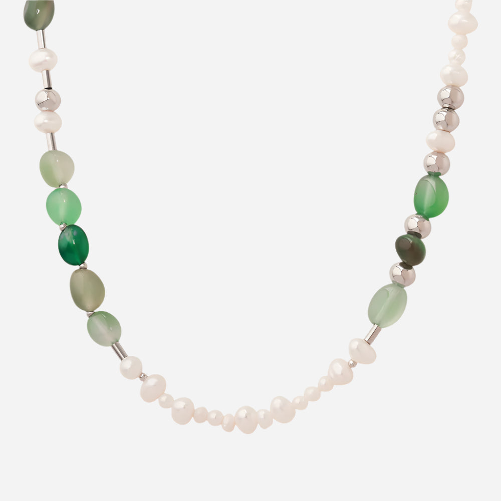 Freshwater pearl necklace with natural stone beads on white background