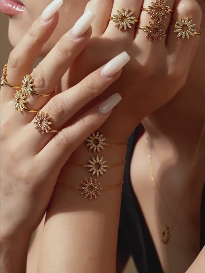 360° view of waterproof gold sunflower charm necklaces with white and pink zirconia stones – perfect for summer styling and layering.